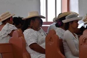 AITUTAKI, COOK ISLAND - AUGUST, 27 2017 - Local people at the mass photo