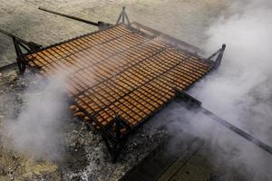 Chorizo roasted on the wood-fired grill photo