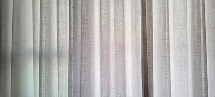 white linen curtain in apartment with sunset view in Brazil photo