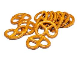 Small pretzels on a white background.   Baking for tea. Crispy biscuits. photo