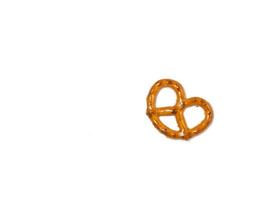 Small pretzel on a white background. Flour product. Baking for tea. Crispy biscuit. photo