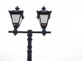 A beautiful street lamp on a background of a gray sky. photo