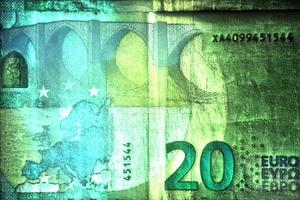 Illustration of glowing euro banknotes with a green kirlian aura around them. photo