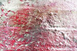 Texture of colorful graffiti paint on conrete and brick walls in red blue purple and silver photo