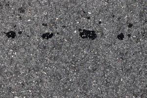 Detailed view on asphalt surfaces of different streets and roads with cracks photo