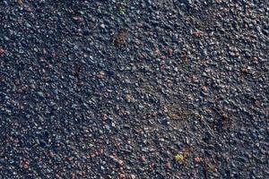 Detailed view on asphalt surfaces of different streets and roads with cracks photo