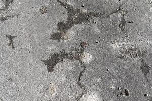 Detailed view on asphalt surfaces of different streets and roads with cracks photo