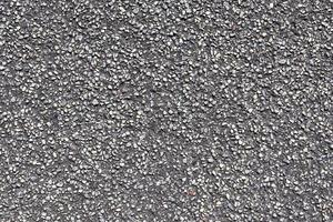 Detailed view on asphalt surfaces of different streets and roads with cracks photo