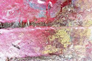 Texture of colorful graffiti paint on conrete and brick walls in red blue purple and silver photo