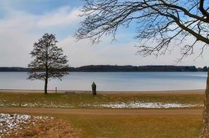 Beautiful landscape at a lake with a reflective water surface photo