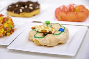 Colorful brioche style donut on a plate in a restaurant photo