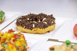 Colorful brioche style donut on a plate in a restaurant photo