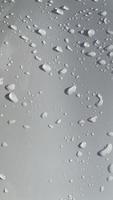 Water droplets perspective through white color surface good for multimedia content backgrounds photo