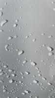 Water droplets perspective through white color surface good for multimedia content backgrounds photo