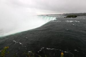 Canadian Falls on the Niagara River on an autumn rainy day. photo