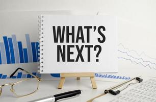 what's new text written on notepad and office supplies photo