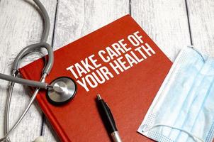 notepad with the inscription - Take care of your health photo