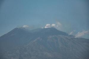 Beautiful volcanic Mount Etna with blue sky in background during summer photo