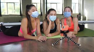 Fitness girls motivate each other in workout session video