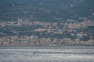 View of Messina cityscape and the Mediterranean sea at island photo