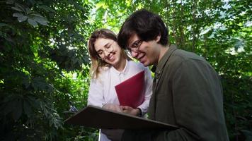 A couple of students doing a botanical research