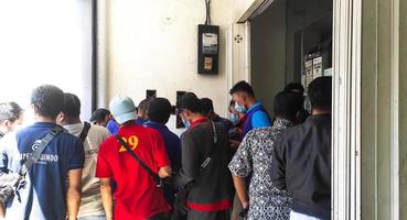 Gresik, Jawa timur, Indonesia, 2022 -  people queuing to register to be recipients of worker aid funds photo