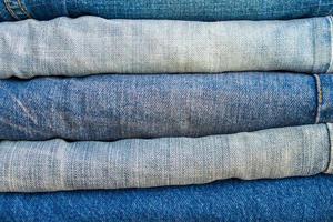 denim blue jeans stack texture background closeup photo