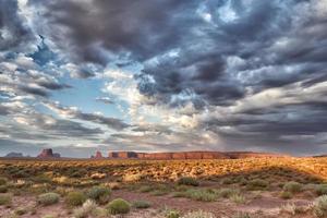 Monument Valley view on cloudy sky background photo