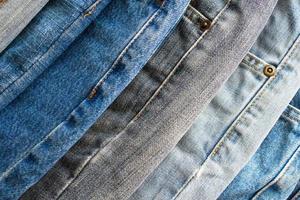 denim blue jeans stack texture background closeup photo