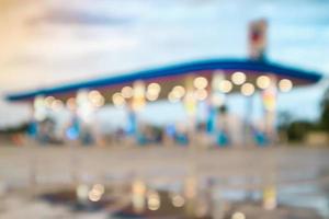 Abstract blur gas fuel station with clouds and blue sky at sunset photo