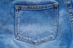 Blue denim jeans back pocket close up photo