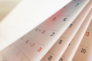 Abstract blur calendar page flipping sheet close up background photo