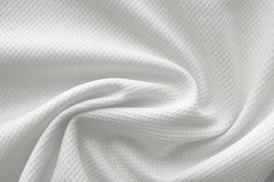 White sports clothing fabric jersey football shirt texture top view close up photo