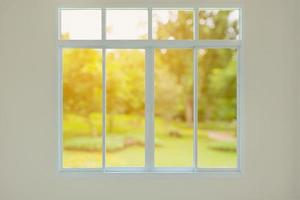 Modern house window with green garden view bokeh background photo