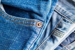 denim blue jeans stack texture background closeup photo