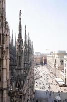 Duomo Di Milano. Rooftop cityscape view of Milan Cathedral, or Metropolitan Cathedral-Basilica of the Nativity of Saint Mary, the cathedral church of Milan, Lombardy, Italy photo