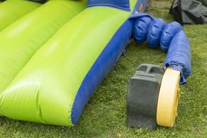 Inflate obstacle course using air generator. photo