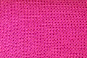 Bright pink knitwear wool fabric texture background. Abstract textile backdrop photo