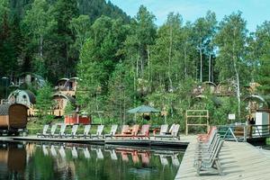 Russia, Vydrino village, Warm Lakes, September 12, 2022, Bilbo Tourist village, small guest houses photo