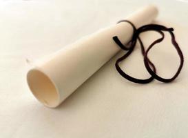 Parchment scroll vellum on a table photo