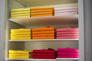 different colors polo shirt on display stand photo