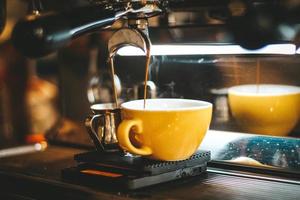 Espresso Machine Dispensing on Two Mug photo