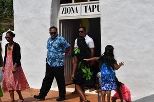 AITUTAKI, COOK ISLAND - AUGUST, 27 2017 - Local people at the mass photo