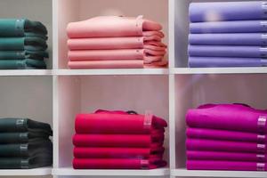wool sweaters on shelves photo