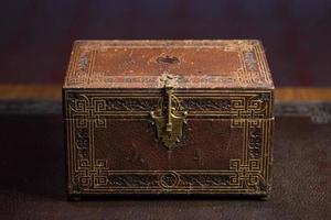 old ancient secret casket on a desk photo