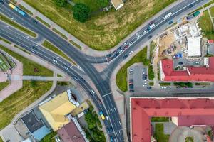 aerial view of road junction with heavy traffic at city photo