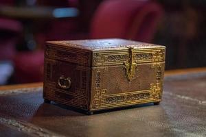 old ancient secret casket on a desk photo