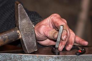 old retired man hands working photo