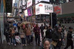 NEW YORK - USA  APRIL 22 2017 times square moving people in rainy day photo