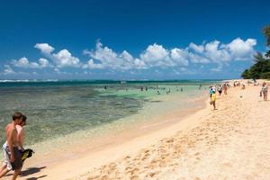 HONOLULU, USA - AUGUST, 14 2014 - People having fun at hawaii beach photo